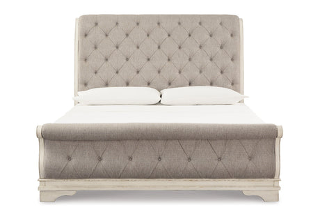Realyn Chipped White King Upholstered Sleigh Bed from Ashley - Luna Furniture