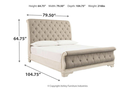 Realyn Chipped White Queen Upholstered Sleigh Bed from Ashley - Luna Furniture