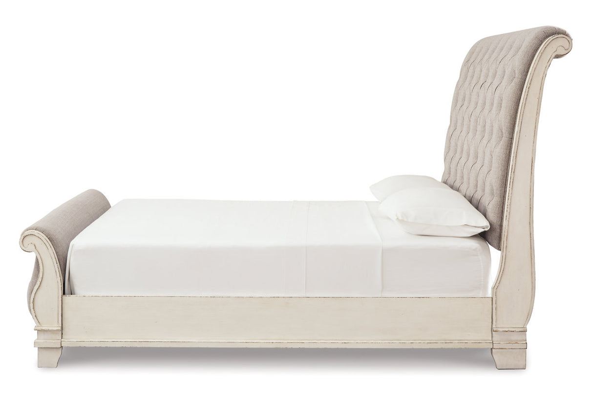 Realyn Chipped White Upholstered Sleigh Bedroom Set from Ashley - Luna Furniture