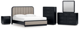 Rowanbeck California King Upholstered Panel Bed with Mirrored Dresser, Chest and Nightstand in Gray/Black from Ashley - Luna Furniture