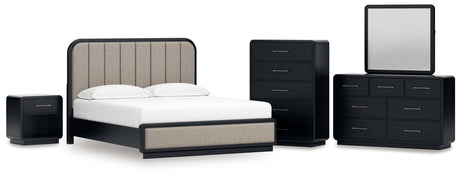 Rowanbeck California King Upholstered Panel Bed with Mirrored Dresser, Chest and Nightstand in Gray/Black from Ashley - Luna Furniture
