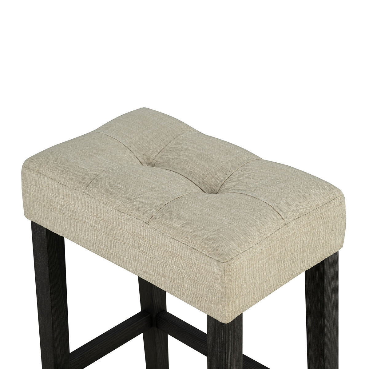 Zanaide counter stool, tufted beige fabric seat, black wood frame close-up