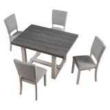 Sauro Gray dining table, dark wood-look top with gray trestle base, three-quarter view