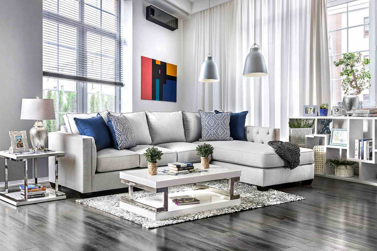 Ornella Light sectional sofa, light gray upholstery and blue pillows, front living room view