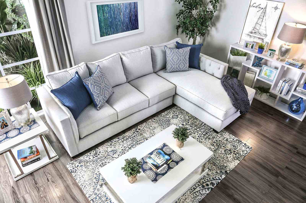 Ornella Light sectional sofa, L-shaped layout with blue pillows, angled room view