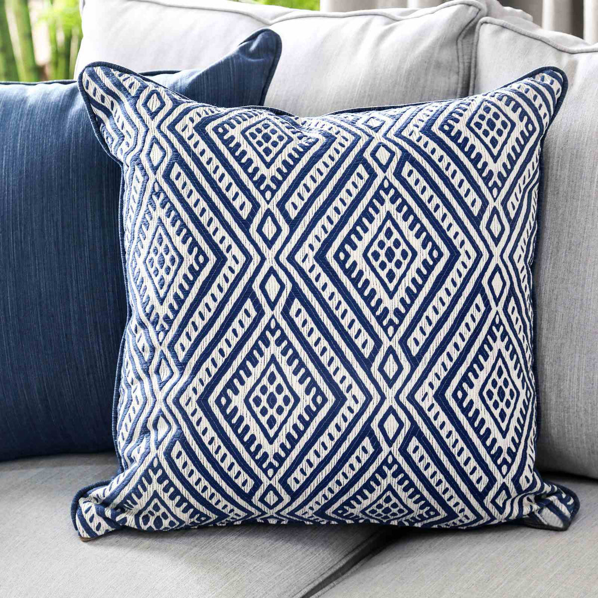Ornella Light geometric accent pillow, blue and white patterned fabric, close-up