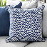 Ornella Light geometric accent pillow, blue and white patterned fabric, close-up