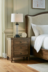 Sturlayne King Upholstered Panel Bed with Mirrored Dresser and 2 Nightstands in Brown from Ashley - Luna Furniture