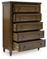 Sturlayne King Upholstered Panel Bed with Mirrored Dresser and Chest in Brown from Ashley - Luna Furniture