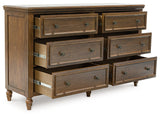 Sturlayne Queen Upholstered Panel Bed with Dresser and 2 Nightstands in Brown from Ashley - Luna Furniture