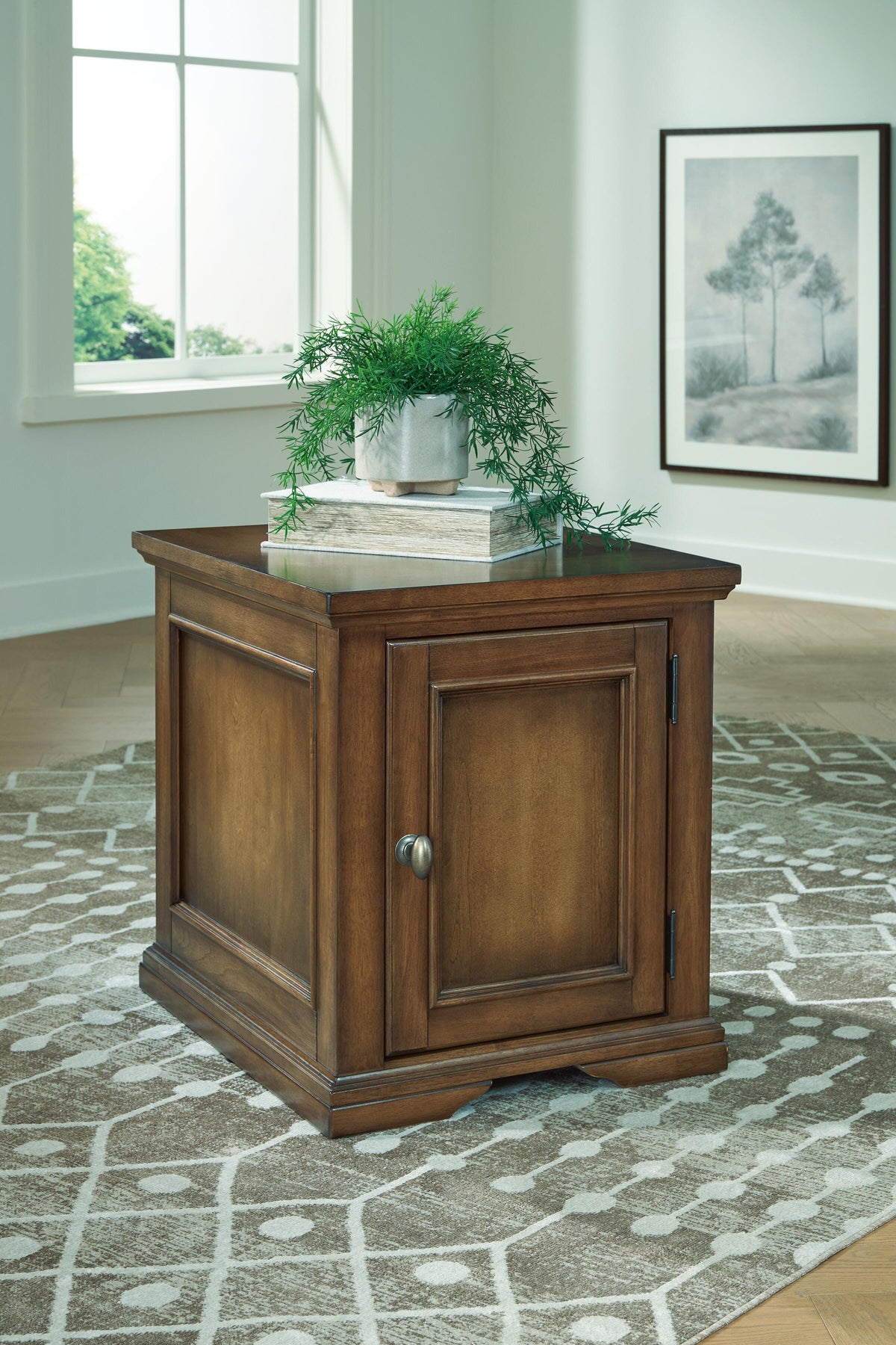 Channley Brown side table in a living room, brown finish and panel detailing, lifestyle view