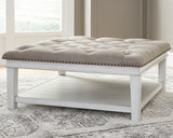 Kanwyn Whitewash Upholstered Ottoman Coffee Table from Ashley Furniture - Luna Furniture
