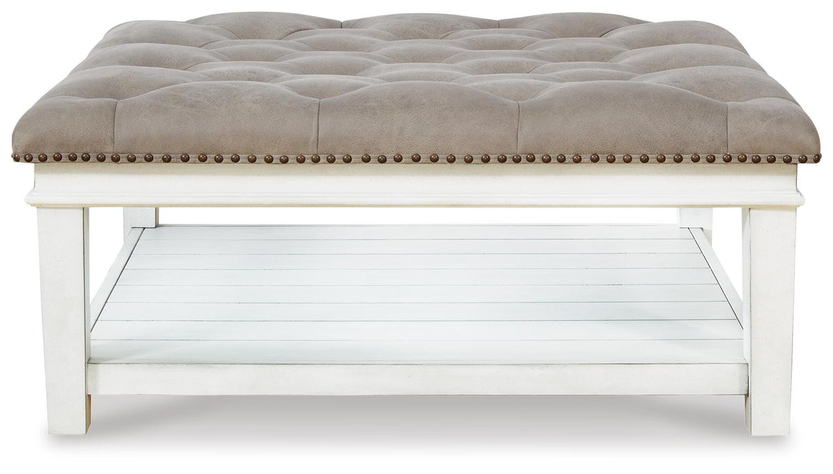 Kanwyn Whitewash Upholstered Ottoman Coffee Table from Ashley Furniture - Luna Furniture