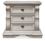 Bruchandi King Upholstered Panel Bed with Mirrored Dresser and Nightstand in Antique White from Ashley Furniture - Luna Furniture