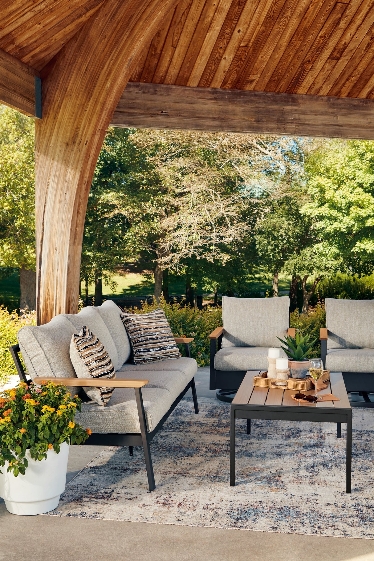 Carmel Highlands Dark Brown Outdoor Sofa/Chairs/Table (Set of 4) from Ashley Furniture - Luna Furniture