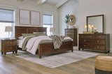 Danabrin King Panel Bed with Mirrored Dresser and Nightstand in Brown from Ashley - Luna Furniture