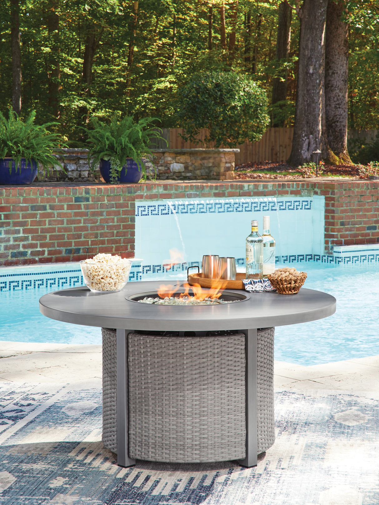 Half Moon Beach Gray Outdoor Fire Pit Table from Ashley - Luna Furniture