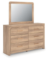 Kinlanni Queen Upholstered Panel Bed with Mirrored Dresser in Tan from Ashley - Luna Furniture