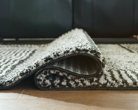 Kurtmen Black/Ivory Large Rug from Ashley Furniture - Luna Furniture