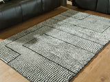 Kurtmen Black/Ivory Medium Rug from Ashley Furniture - Luna Furniture