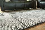 Kurtmen Black/Ivory Medium Rug from Ashley Furniture - Luna Furniture