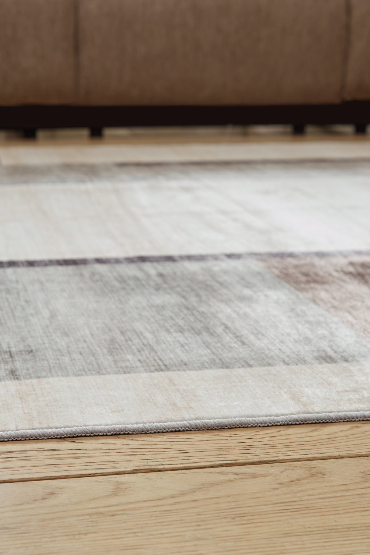 Larkport Cream/Brown/Gray Washable Large Rug from Ashley - Luna Furniture