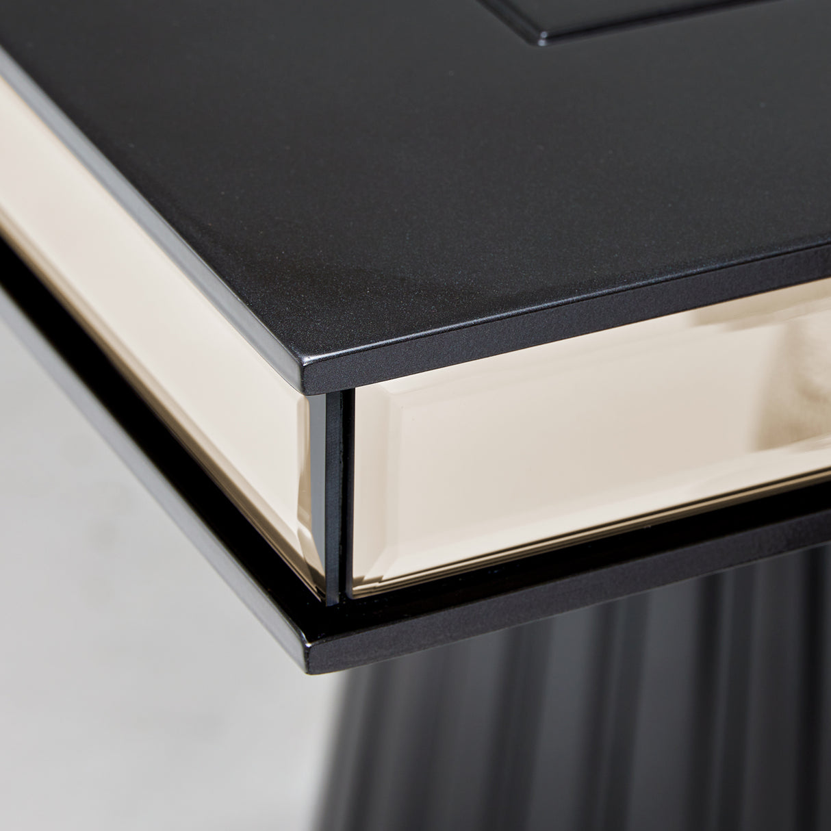 Carmela Glossy Charcoal Sand Pedestal Dining Table from Michael Amini - Luna Furniture