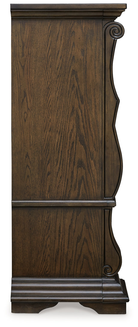 Maylee Dark Brown California King Upholstered Bed with Mirrored Dresser and Chest from Ashley Furniture - Luna Furniture