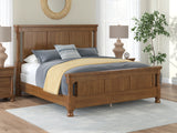 Rowlenstown California King Poster Bed with Dresser in Brown from Ashley - Luna Furniture