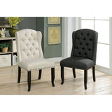 Sania Antique side chairs, beige and charcoal upholstery, wingback tufted design, three-quarter view