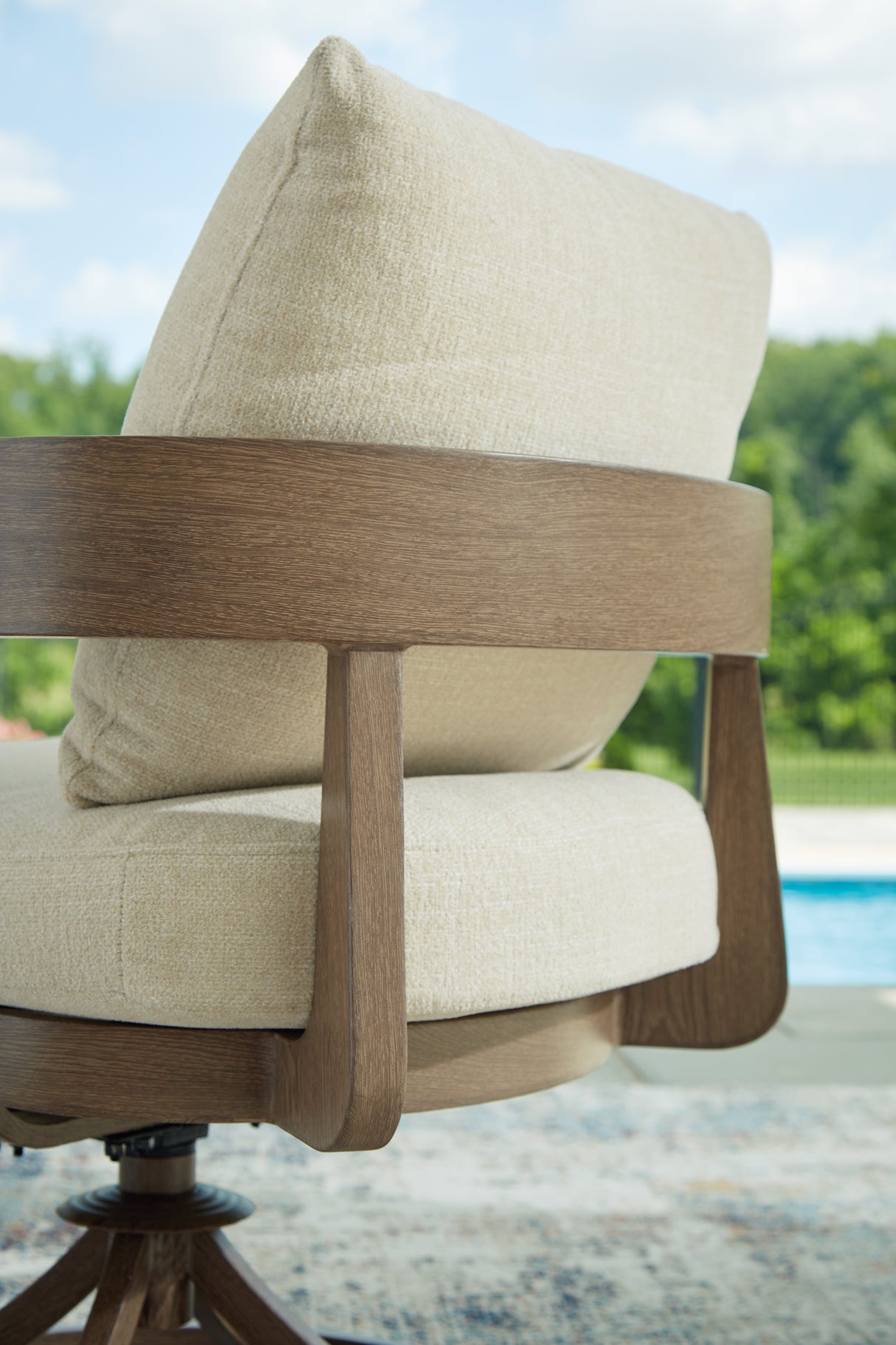Serene Bay Dark Brown/White Outdoor Swivel Dining Chair with Cushion from Ashley - Luna Furniture