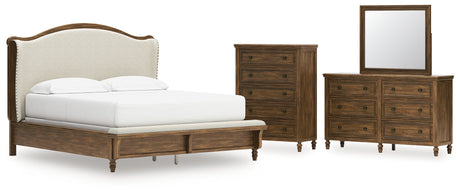 Sturlayne California King Upholstered Panel Bed with Mirrored Dresser and Chest in Brown from Ashley - Luna Furniture