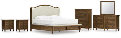 Sturlayne King Upholstered Panel Bed with Mirrored Dresser, Chest and 2 Nightstands in Brown from Ashley - Luna Furniture