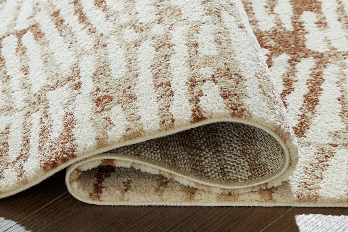 Uduak Cream/Tan/Rust Large Rug from Ashley - Luna Furniture