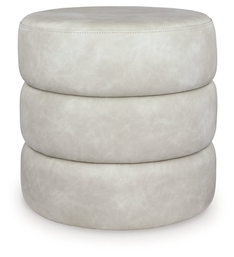 Ummi Bone Swivel Accent Ottoman from Ashley - Luna Furniture