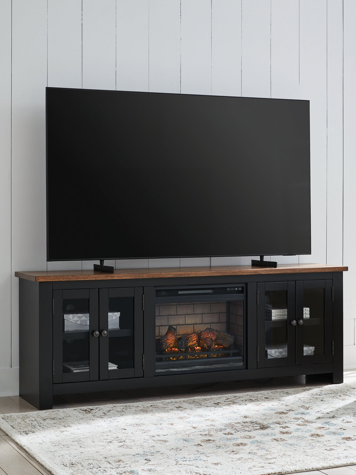 Wildenauer Brown/Black 76" TV Stand with Electric Fireplace from Ashley Furniture - Luna Furniture