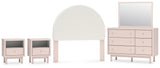 Wistenpine Full Upholstered Panel Headboard with Mirrored Dresser and 2 Nightstands in Blush from Ashley - Luna Furniture