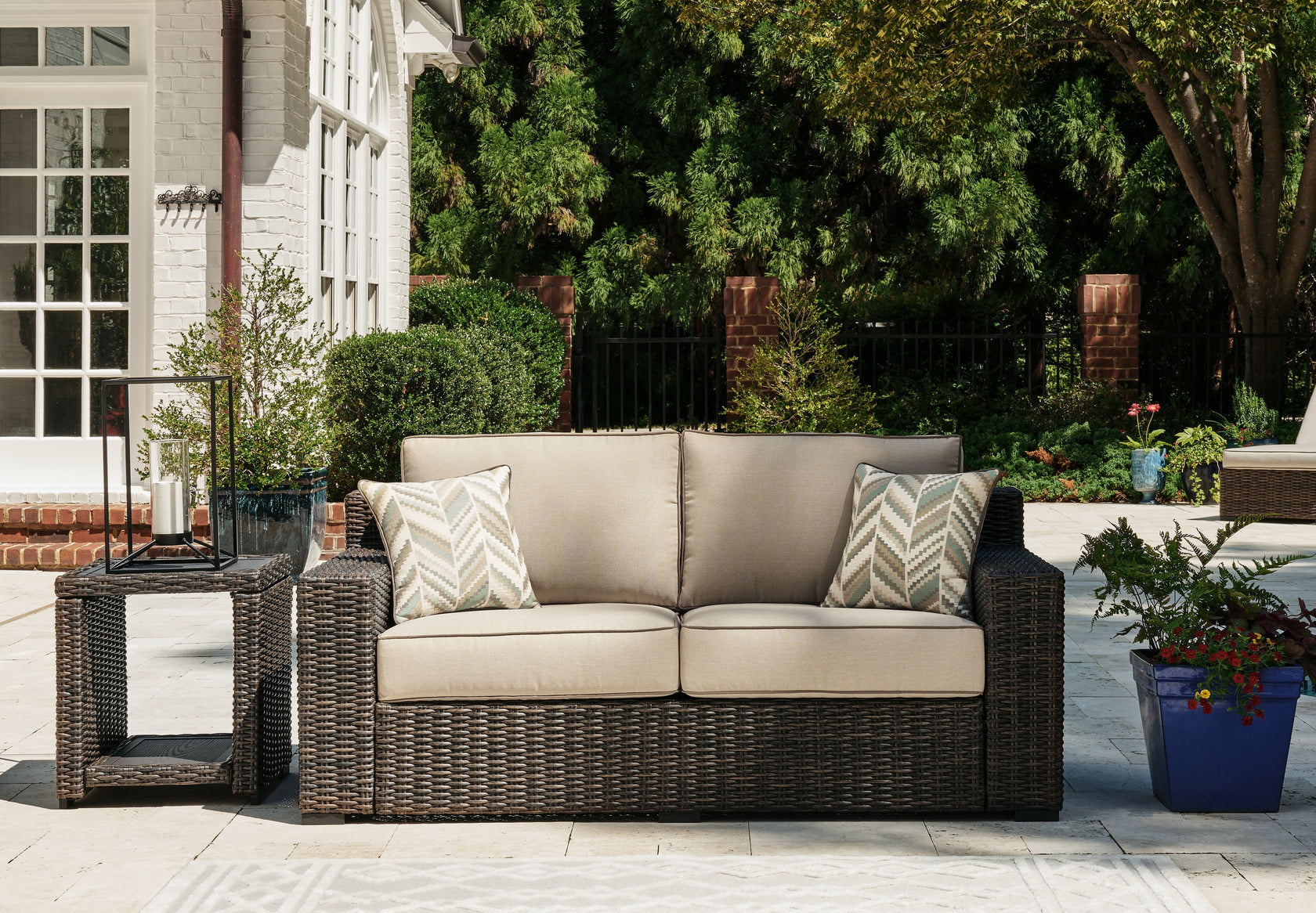 Coastline Bay Brown Outdoor Loveseat with Cushion from Ashley - Luna Furniture