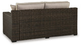 Coastline Bay Brown Outdoor Loveseat with Cushion from Ashley - Luna Furniture