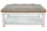 Kanwyn Whitewash Upholstered Ottoman Coffee Table from Ashley - Luna Furniture
