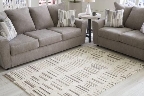 Leesdale Ivory/Brown/Black 5' x 7' Rug from Ashley - Luna Furniture
