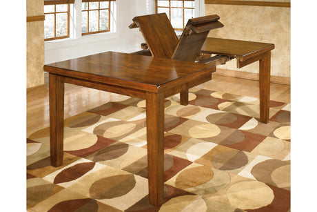 Ralene Medium Brown Dining Extension Table from Ashley - Luna Furniture