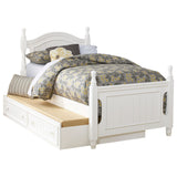 Clementine White Twin Platform Bed with trundle, paneled headboard and white finish, three-quarter view