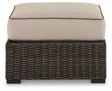 Coastline Bay Brown Outdoor Ottoman with Cushion from Ashley - Luna Furniture