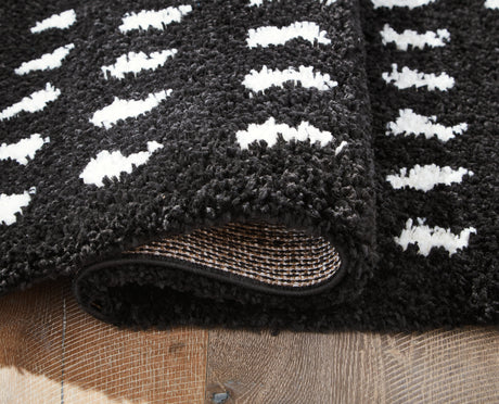 Minston Black/White 5' x 7' Rug from Ashley - Luna Furniture