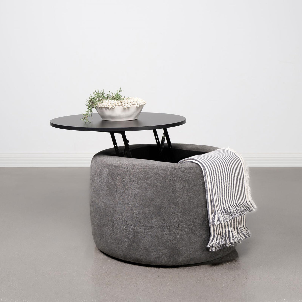 Tesoro Gray and Black Upholstered Round Lift Top Storage Ottoman from Coaster - Luna Furniture